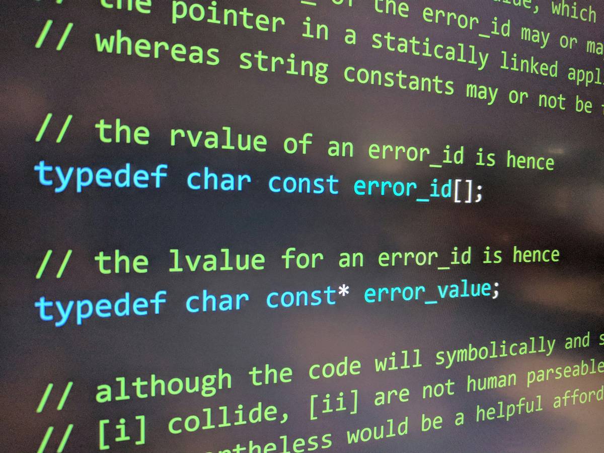 typical c program development environment showing VS Code with GCC compiler, terminal, and file explorer open side-by-side for C++ game coding